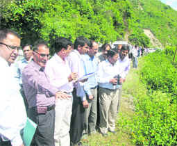 A team of the Central government inspects an area in Nainital district on Thursday. 