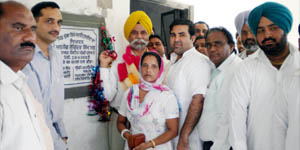 Former minister Joginder Singh Maan along with sarpanch Paramjit Kaur inaugurates solar lights at Duggan village on Wednesday.