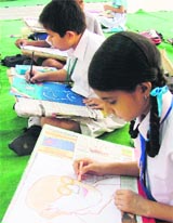 Students participate in a painting contest at Kamla Lohtia SD College in Ludhiana on Thursday.