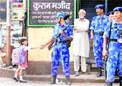 A girl shakes hands with a jawan from the Rapid Action Force, in Mumbai 