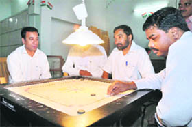 A match of the Bar Association Carrom Tournament under way in Dehradun on Friday.