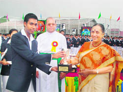 Uttarakhand Governor Margaret Alva hands over a trophy to a winner at the annual 