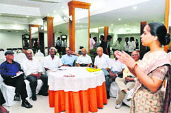 A counsellor addresses elderly persons at a function in Dehradun on Friday.