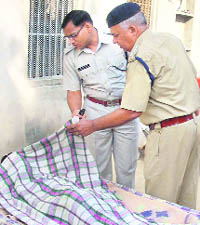 Policemen at the murder site.