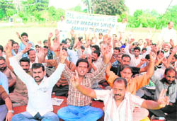 Members of the All-J&K Agricultural Daily Wagers Union protest in support of their pending demands in Jammu