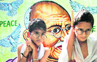 Students of Shangrilla Higher Secondary School dressed up as Mahatma Gandhi on the eve of Gandhi Jayanti in Jammu 