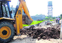 An illegal structure being razed at Gill village near Ludhiana