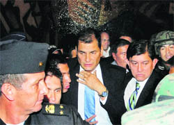 Ecuador's President Rafael Correa arrives at the government palace after being rescued by soldiers from the hospital where he had been trapped in Quito on Thursday. 
