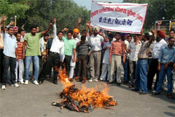 Members of the Unemployed DPE/M.P.Ed Teachers Union burn an effigy of the Badal government outside the main bus stand in Bathinda on Saturday