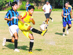 A player kicks the ball during a game at the Football Stadium, Sector 17,in Chandigarh on Saturday.