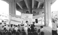 Congress workers, along with shopkeepers, celebrate Gandhi Jayanti beneath the Zirakpur flyover on Saturday. 