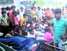 Workers hold a protest outside a factory in Ludhiana on Saturday
