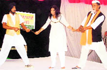 Artistes enact the play Dhi di Vangar at Amloh on Saturday