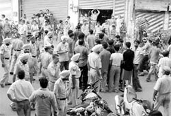 Residents assemble outside a hotel near Nawa Mohalla in Ludhiana on Saturday