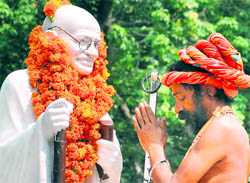 A sadhu pays tributes to Mahatma Gandhi in Jalandhar on Saturday