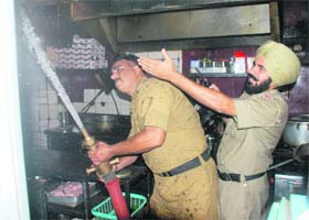 Firemen try to douse flames at Chawla Dhaba in Sector 46, Chandigarh