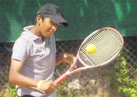 A player in action during the LD Kapoor Memorial Total Tennis Tournament at Sector 11, Chandigarh