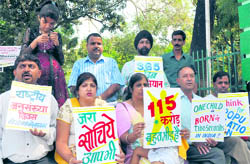 Members of the Surbhi Parivar Foundation stage a dharna at the Gandhi Park in Dehradun on Saturday