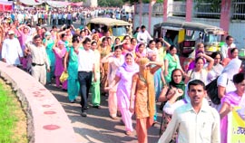 Guest teachers hold a demonstration in Rohtak on Sunday.