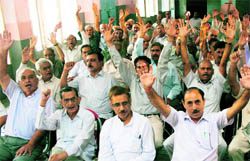 Members of the All-J&K Pensioners Association hold a rally in support of their demands in Jammu on Sunday