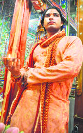 Deepak Sharma performs aarti at a temple in Ludhiana. 