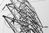 A man carries out repair work on an electricity tower without safety measures at Panchkula