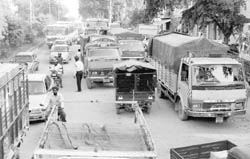 Vehicles parked along the highway at sales tax barrier at Zirakpur. 