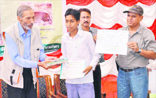 Former Chief Wildlife Conservator of Uttarakhand Anand Singh Negi with Wildlife Warden Vikram Singh Tomar at a programme at the Chilla Range of the Rajaji National Park near Haridwar on Monday.