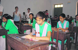 Students take an aptitude examination in Dehradun on Sunday.