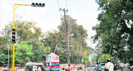 A newly installed traffic light at a busy intersection in Dehradun.