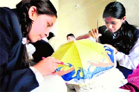 Students take part in an inter-school painting competition organised by NGO Sankalp at the Ridge in Shimla on Monday.