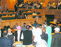BJP members raise slogans before staging a walkout from the state Assembly in Srinagar on Monday.