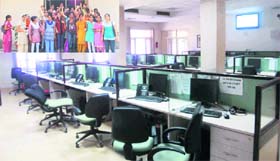 Deserted workstations at the PSPCL call centre, as (inset) telephone/computer operators hold a protest in Ludhiana