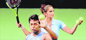 Leander Paes and Sania Mirza celebrate after beating Roheman and Richelieu (LCA) on Monday.