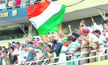 Jubilant fans celebrate India's victory at the PCA Stadium in Mohali on Tuesday. 
