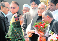 President Pratibha Patil being greeted by Pardip Mehra, Adviser to the UT Administrator, on her arrival at the Chandigarh airport on Tuesday. Also seen in the picture are Punjab Governor Shivraj Patil and Chief Ministers of Punjab and Haryana Parkash Singh Badal and Bhupinder Singh Hooda, respectively.