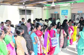 Patients in a queue to get medicines at the Doon Hospital on Tuesday. 