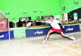 A player in action at the District Badminton Championship in Dehradun
