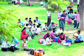 Relatives of B.Ed aspirants wait outside the counselling centre in the University of Jammu