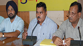 Contractors address the media in Jalandhar on Tuesday.