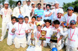 Members of the St Annes cricket team after winning the Ist Wg Cdr Giani Memorial Cricket Trophy in Chandigarh on Wednesday