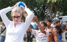 Shona Robison, minister of public health and sport, Scotland, plays with streetchildren in New Delhi