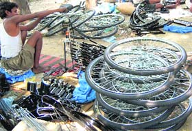 A worker assembles bicycle parts in Government Girls Senior Secondary School in Rohtak