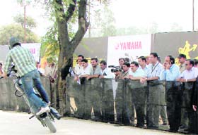 A motorcyclist displays his skills in Gurgaon