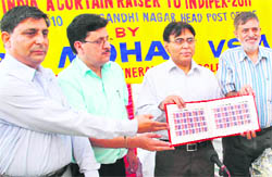 YPS Mohan, Chief Postmaster-General, Jammu and Kashmir circle, releases postage stamps at the Head Post Office in Jammu