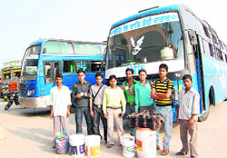 A group of stranded passengers of a bus that was stopped for checking at Rajpura on Tuesday.