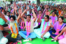 Members of the Punjab State Ministerial Services Union, including those observing hunger strike (wearing garlands), raising slogans in support of their demands outside the Mini-secretariat in Bathinda on Wednesday.