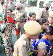 Unemployed ETT teachers are taken into custody outside Khalsa College, Amritsar, on Wednesday. 