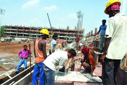 File photo of labourers working at a Games site