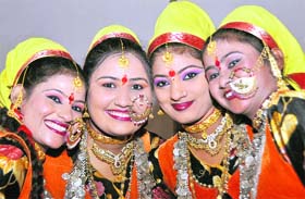 Kumaoni artistes pose prior to a cultural show at the Saras Mela in Dehradun